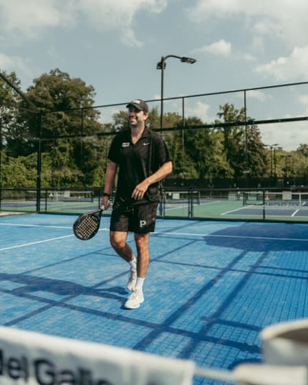 A player with a padel racket on an outdoor court at PATL Atlanta